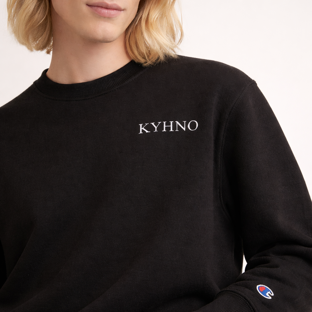 Black sweatshirt with 'KYHNO' logo on a plain background