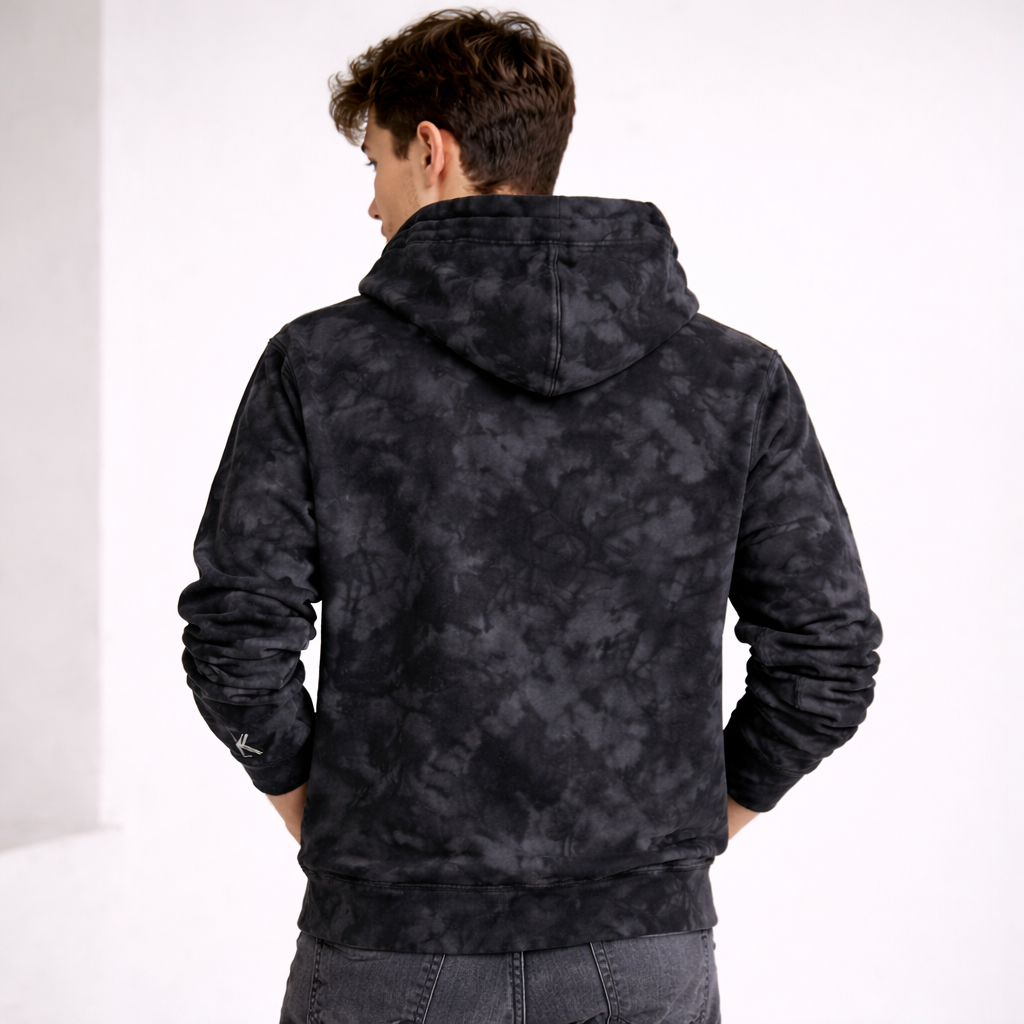 Person wearing a black patterned hoodie with 'KYHNO' branding.